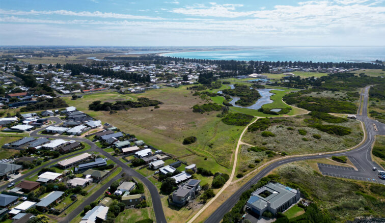 Aerial view of Port Fairy from peas soup looking back towards the Moyne river and town. The ocean is in the background.
